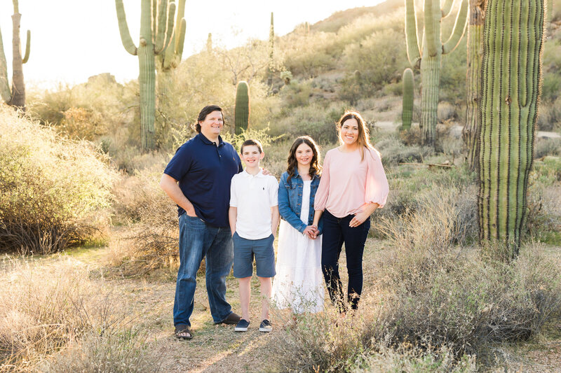 family smiling at camera in Mesa Arizona desert