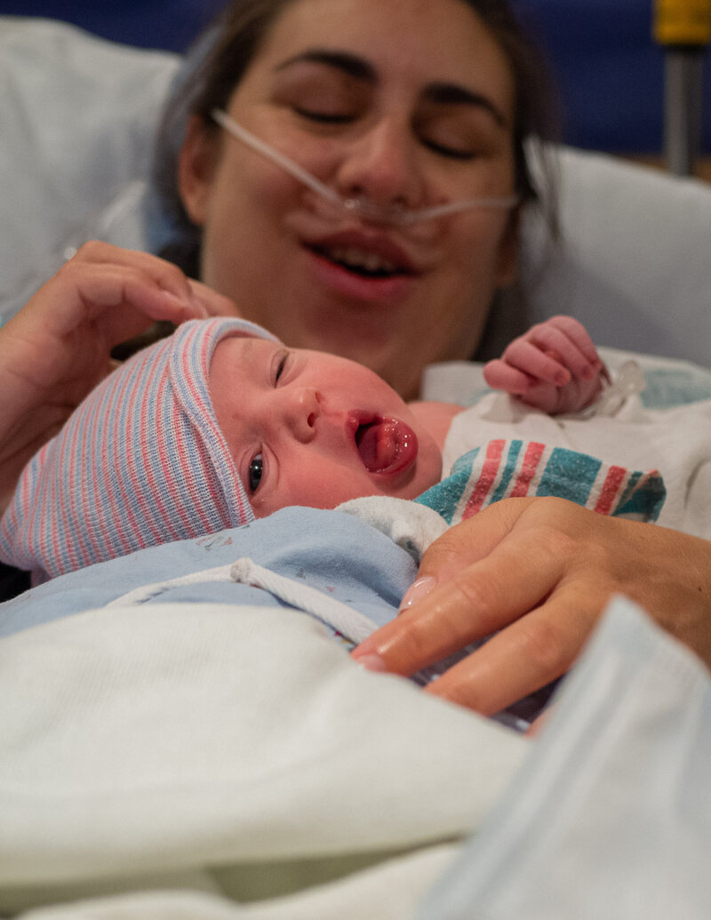 A mother is holding her baby for the first time after giving birth at EvergreenHealth Family Maternity Center in Kirkland, WA.