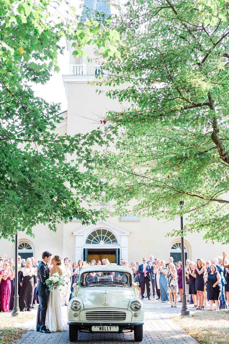 couples ceremony exit with vintage car