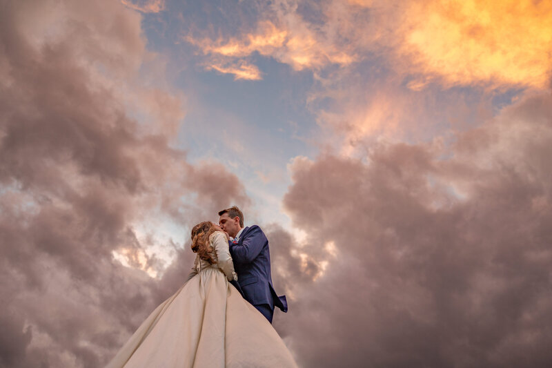 Couple pose during their Glacier National Park Wedding at Paradise Meadow