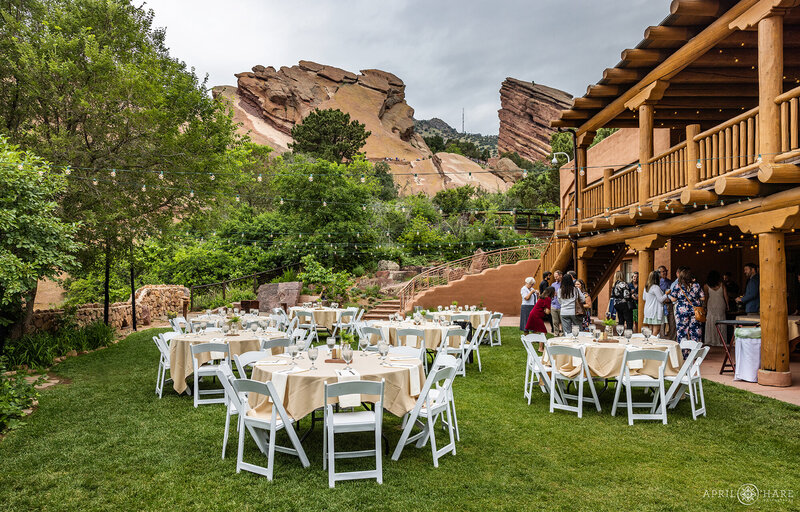 Red Rocks Trading Post Backyard Wedding Reception with Tables Set up on the Lawn under String Lights