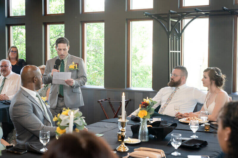 geogria wedding photography of groomsman giving toast at wedding
