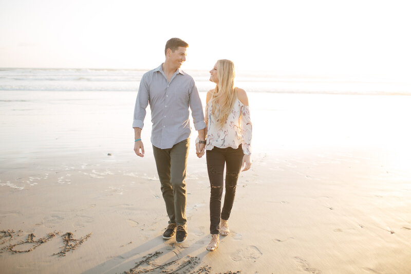 Engagement session on a Seattle beachfront at sunset.