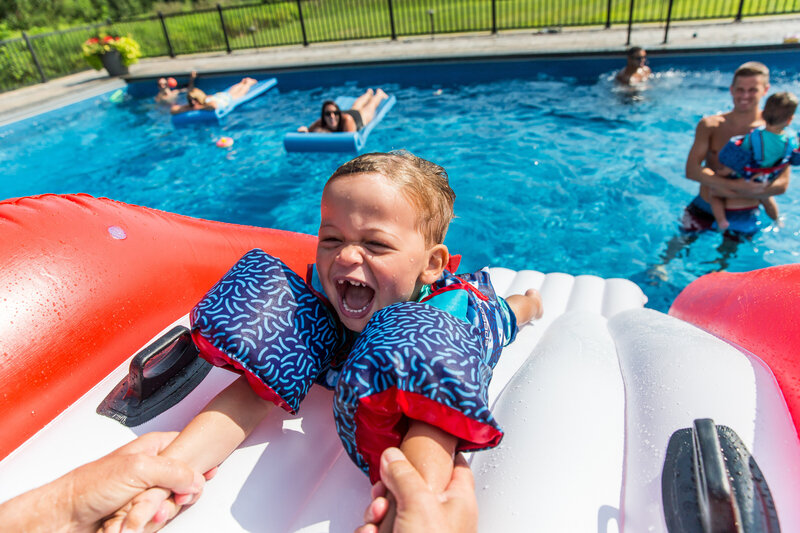 Photo of toddler in pool during Denver Family Photo session