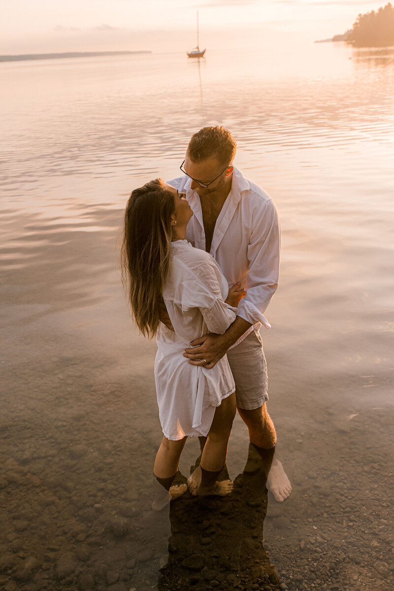 couple wearing all white in engagement photos