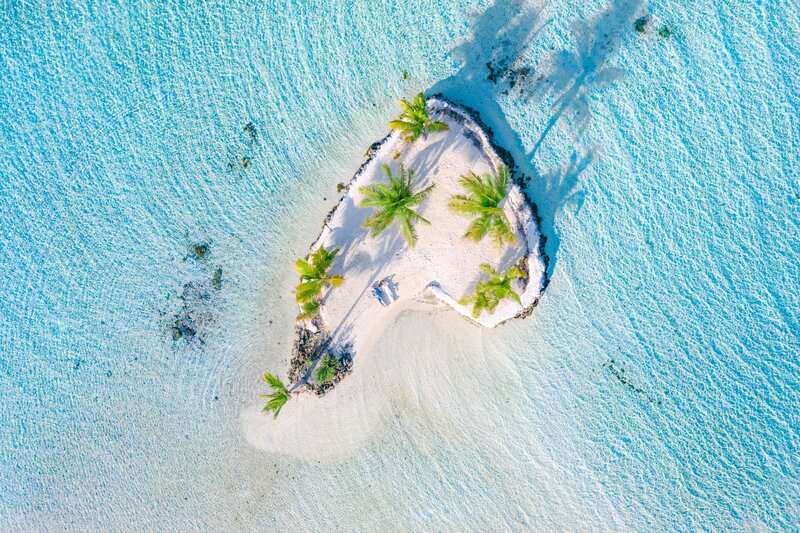Aerial drone view with the bride and the groom in French Polynesia (pacific island)