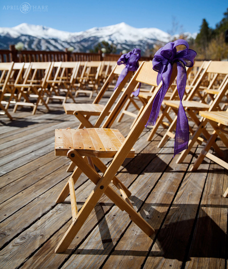 An outdoor wedding on a deck with gorgeous views of Breckenridge Ski Resort in Colorado