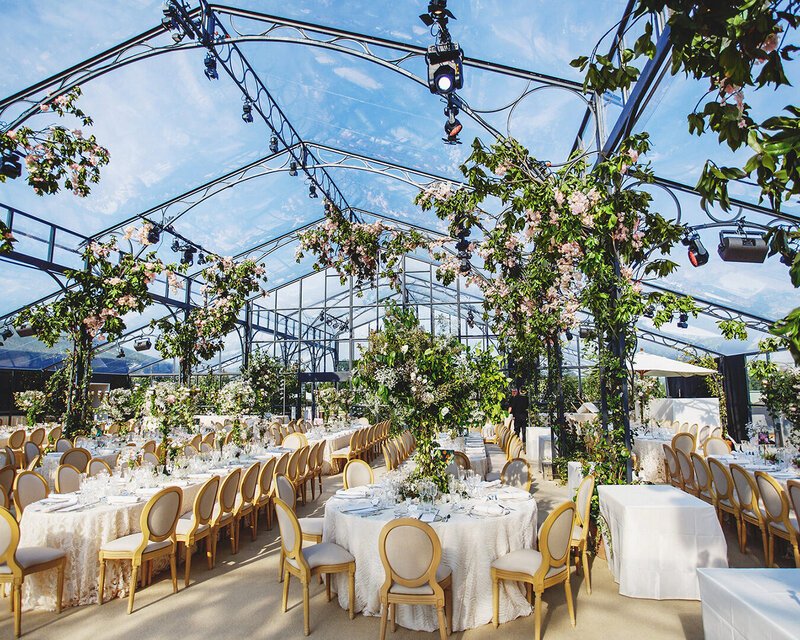 Outdoor wedding reception venue in Normandy with large floral arrangements