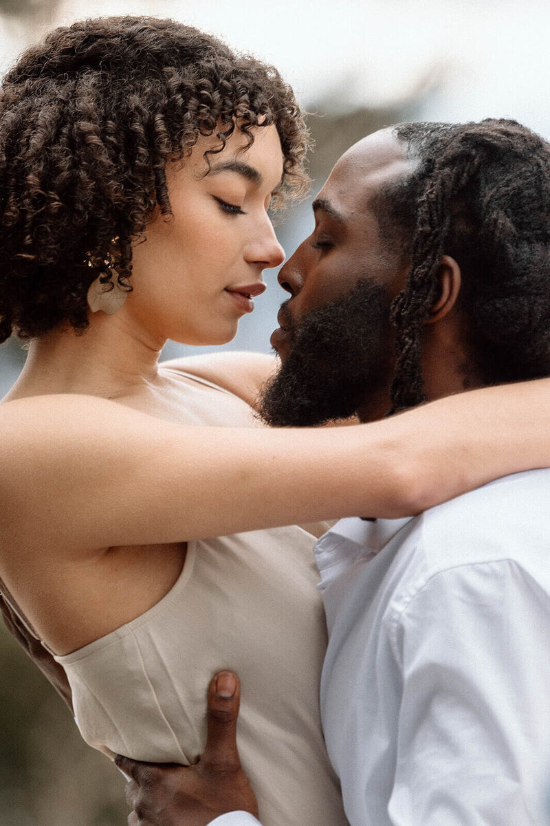 black bride and groom hold each other