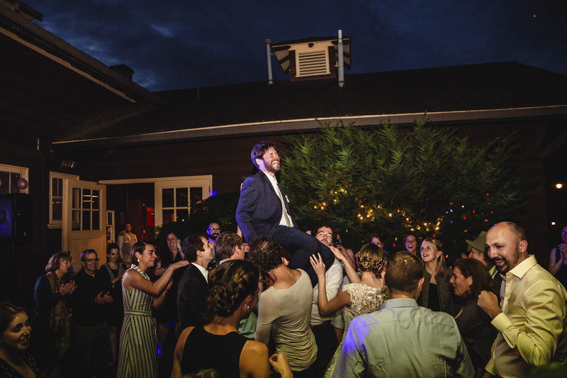 groom lifted on chair horah dance at wedding receptino at Jenkins Estate in Oregon
