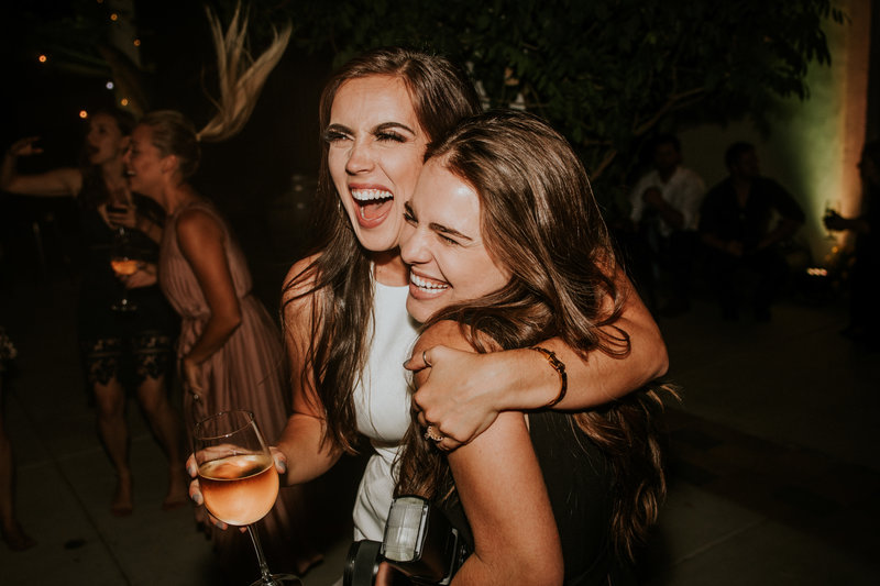 girls laughing at party