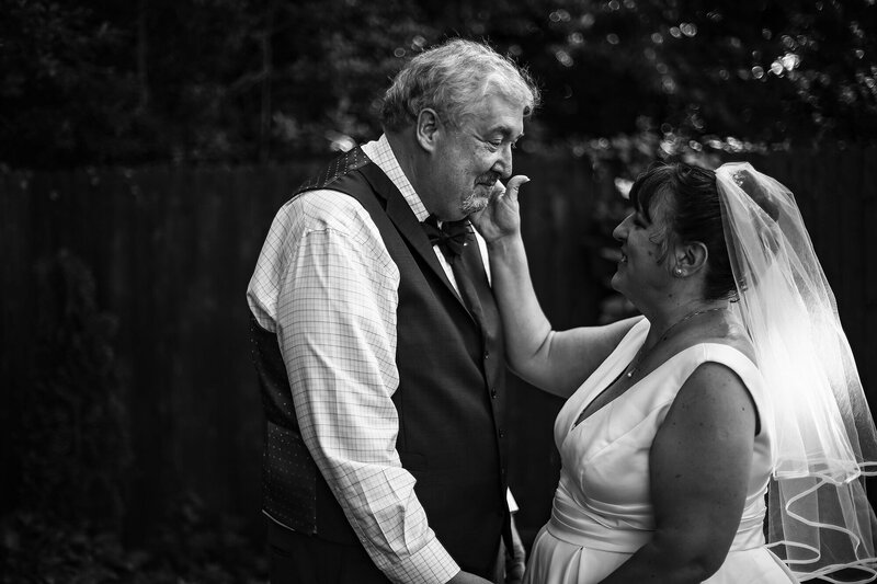 First look between bride and groom before intimate garden wedding in Erie, PA