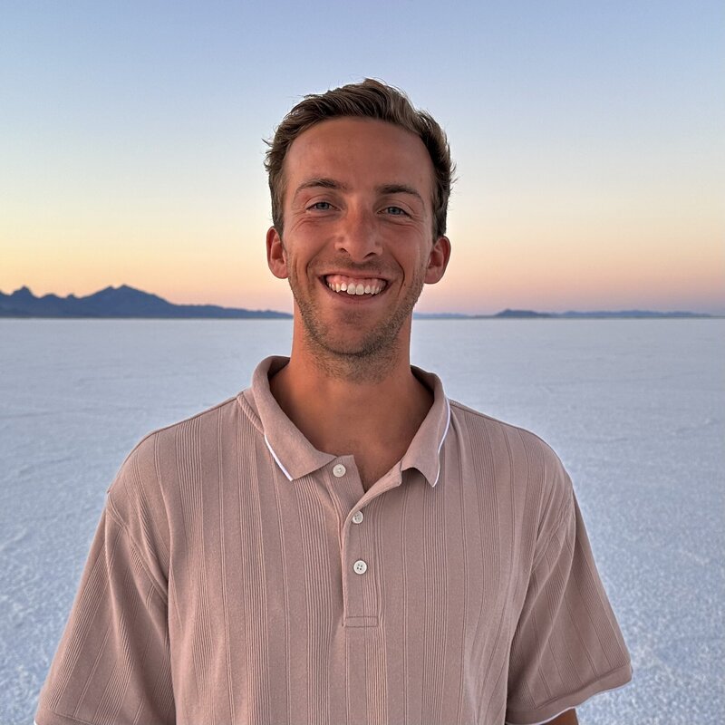 Brian Allender, the founder of Strive Learning Solutions, with mountains in the background.