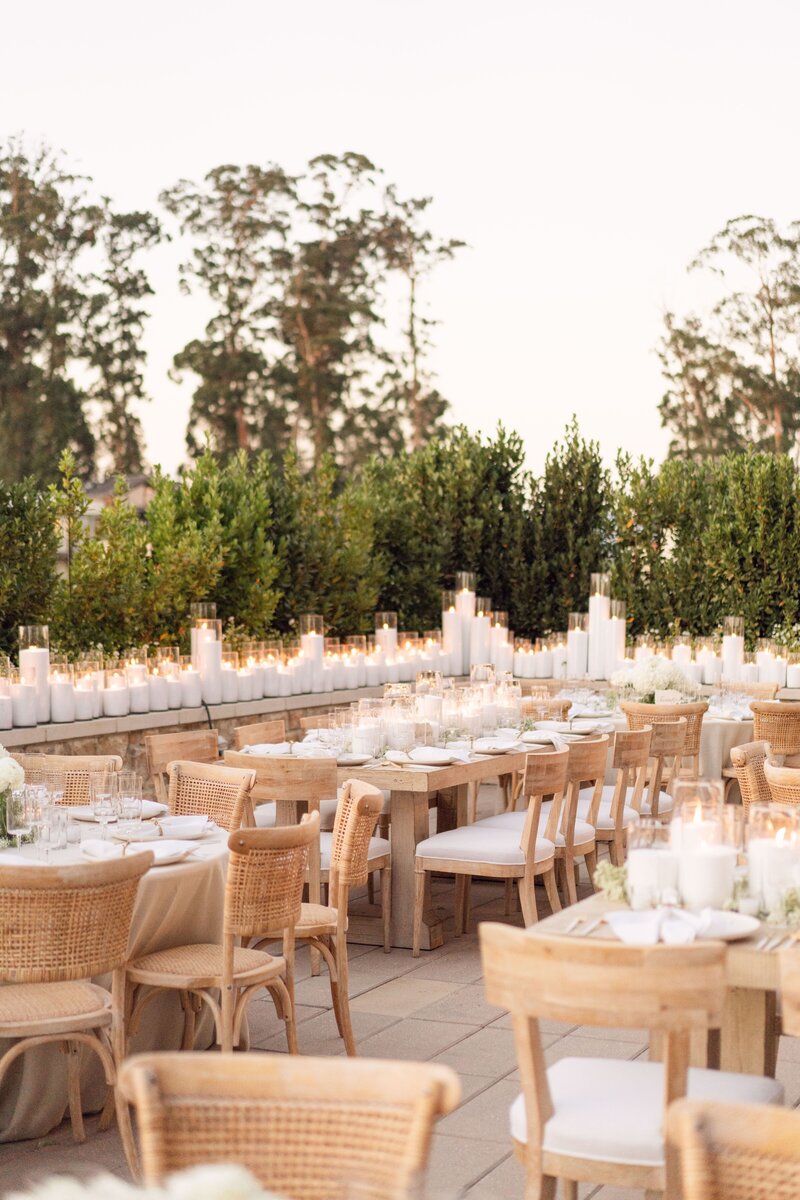 Close up of a long wedding table decorated with baby's breath flowers