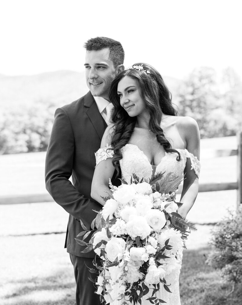 Couple-holding-each-other-on-their-wedding-day