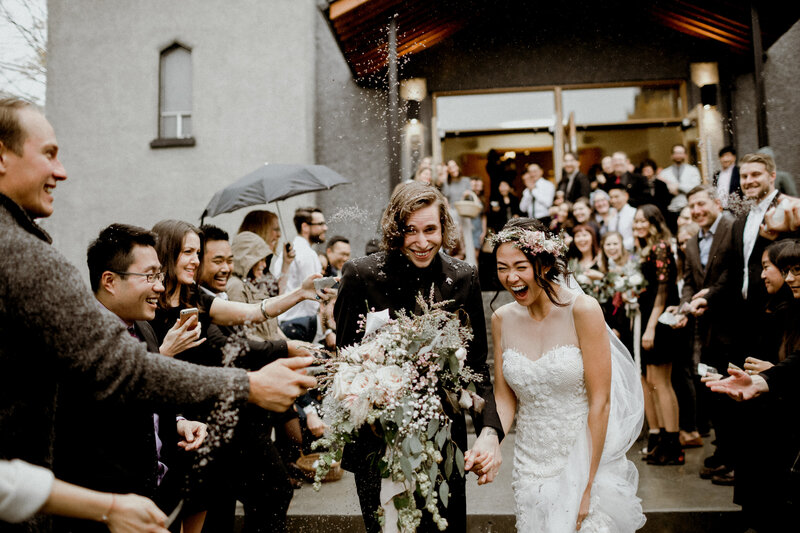 Daisy and Jeremy happily walking out of their church wedding