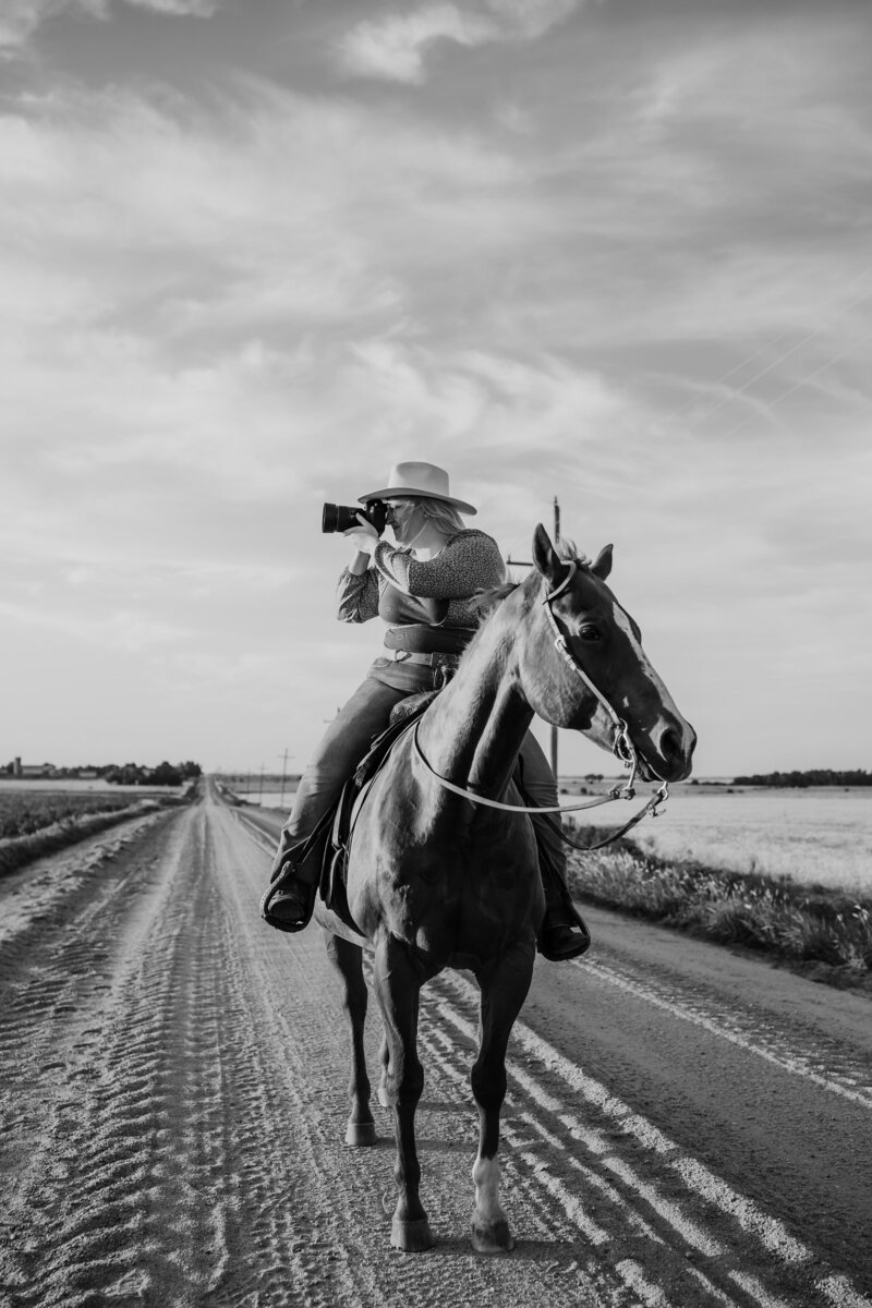 photographer on horse in black and white