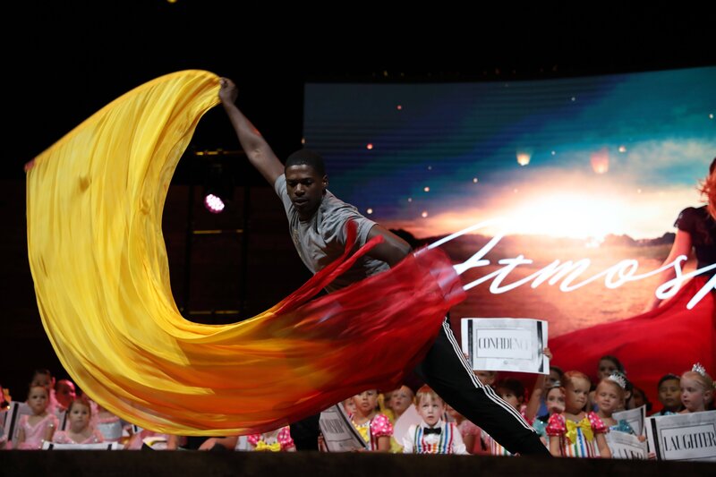 Dancer with red and yellow flag