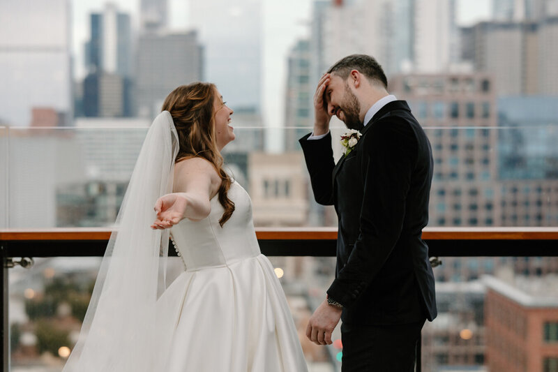 groom admires his bride after their first look