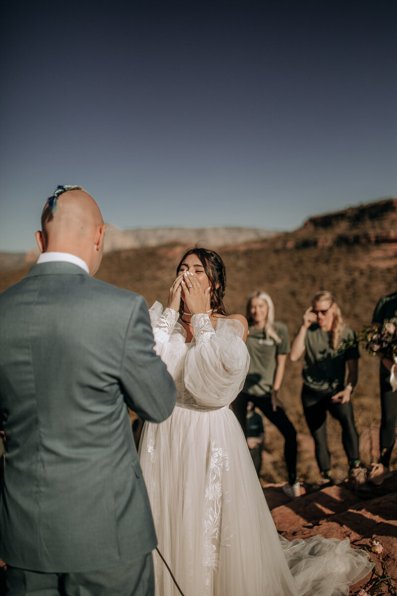 bride crying during wedding vows ceremony in sedona vortex