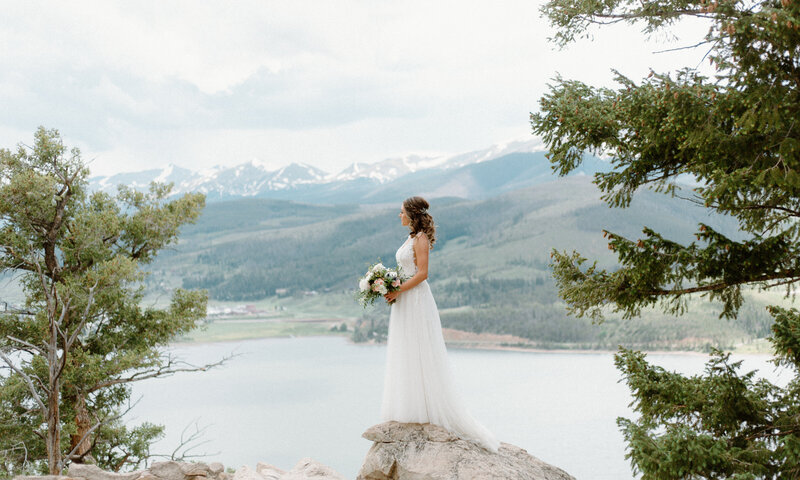 bride standing at Sapphire Point Overlook in Breckenridge, Colorado