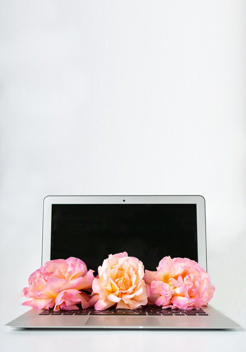 Open_laptop_flowers_full_vertical