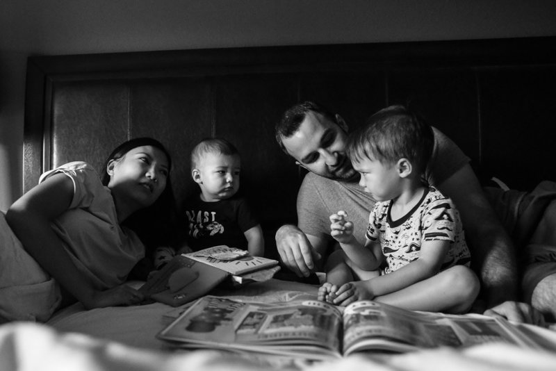 family-documentary-photography-reading-children-bed