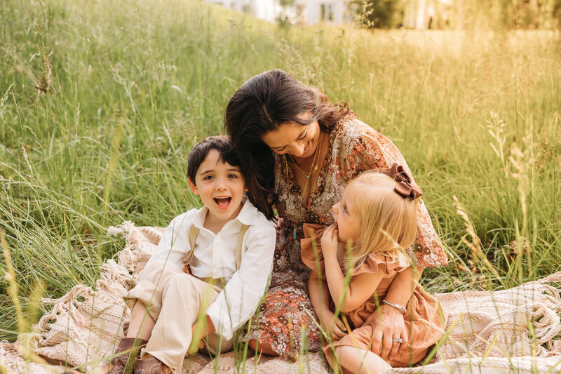 mom smiling with boy and girl
