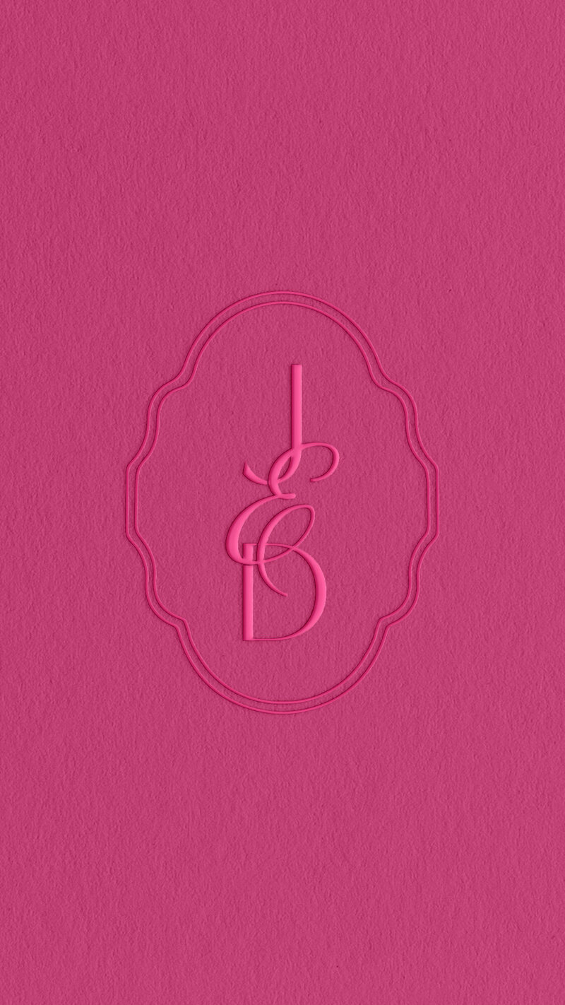 a mockup of a logo embossed on pink paper
