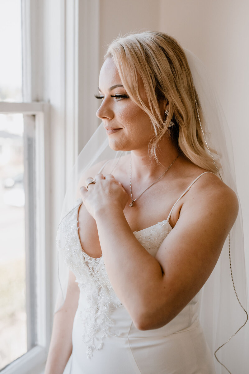 bride looks out the window