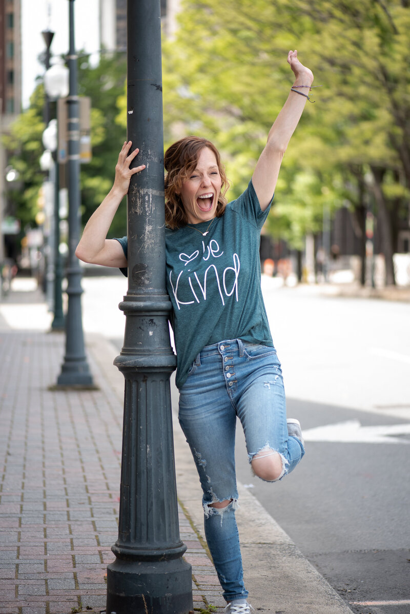 Woman yelling excitedly during her photo session in Charlotte North Carolina.