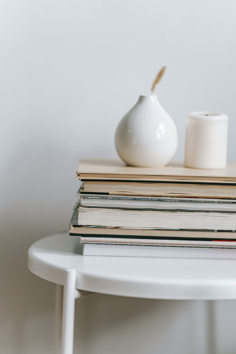 Vases stacked on books