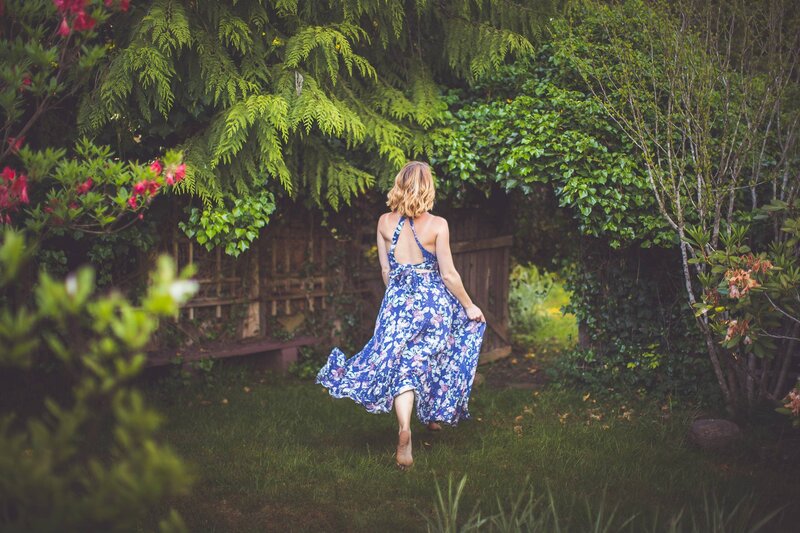 Chelsea Dawn running through her Vancouver Island home garden.