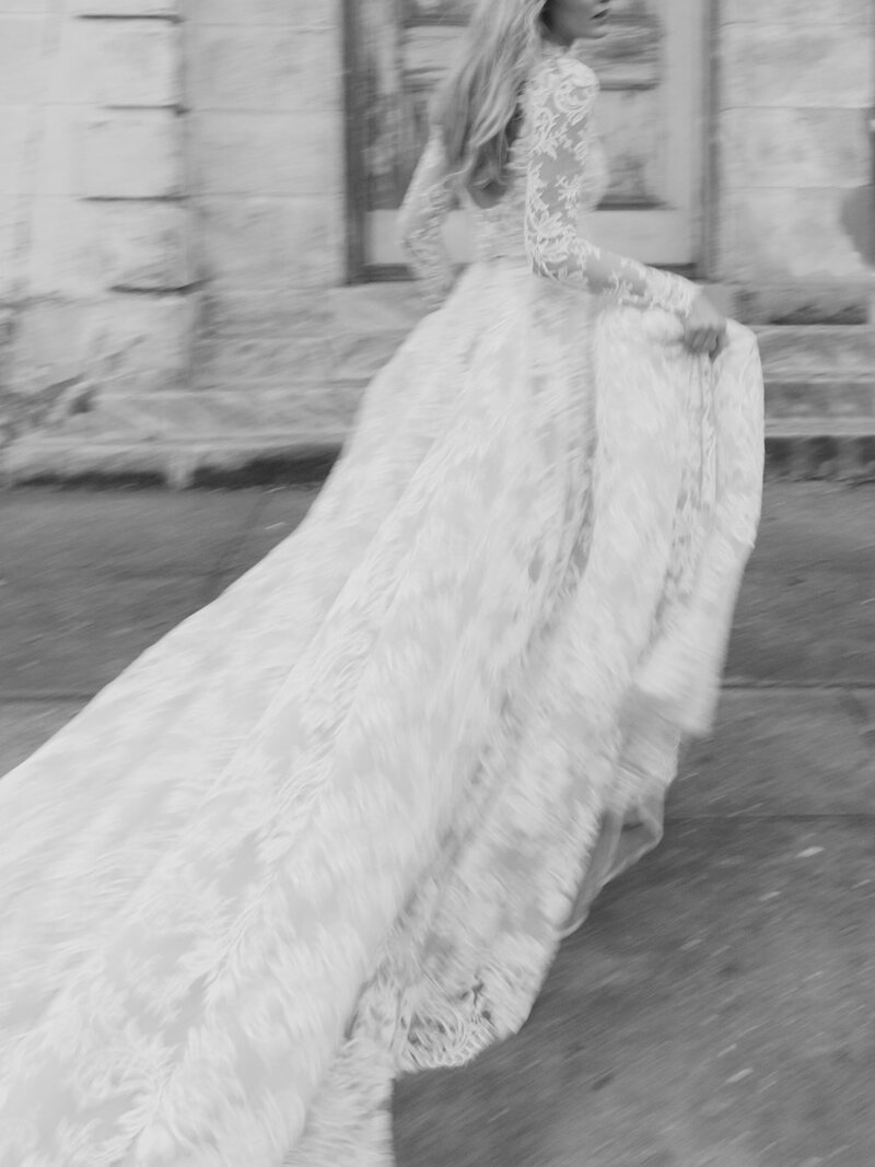 A bride rushes by on her wedding day in Dumbo