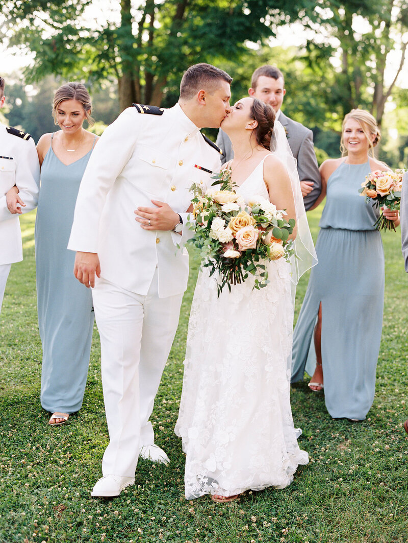 Navy Wedding Kiss with bridal party