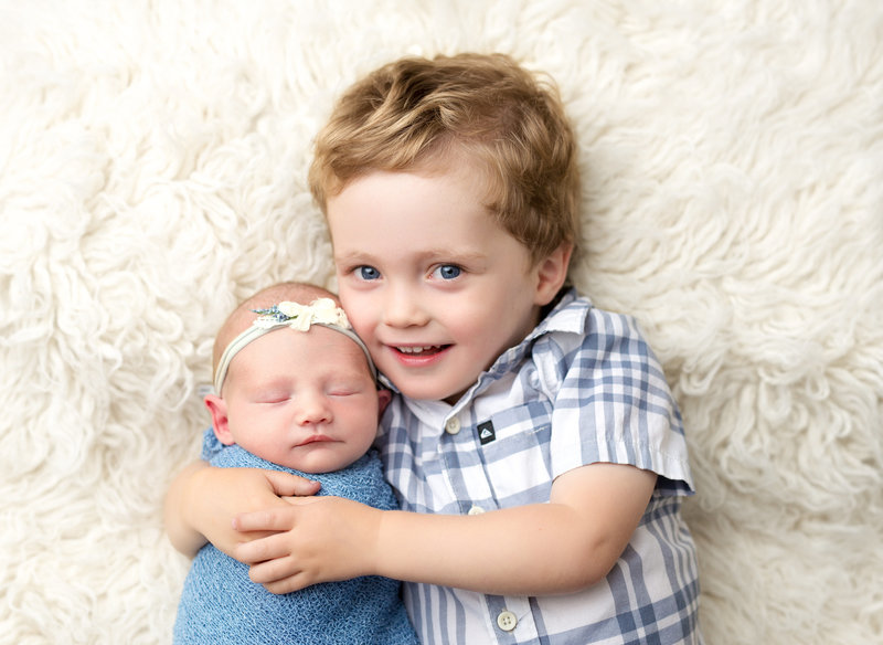 Baby brother with newborn sister