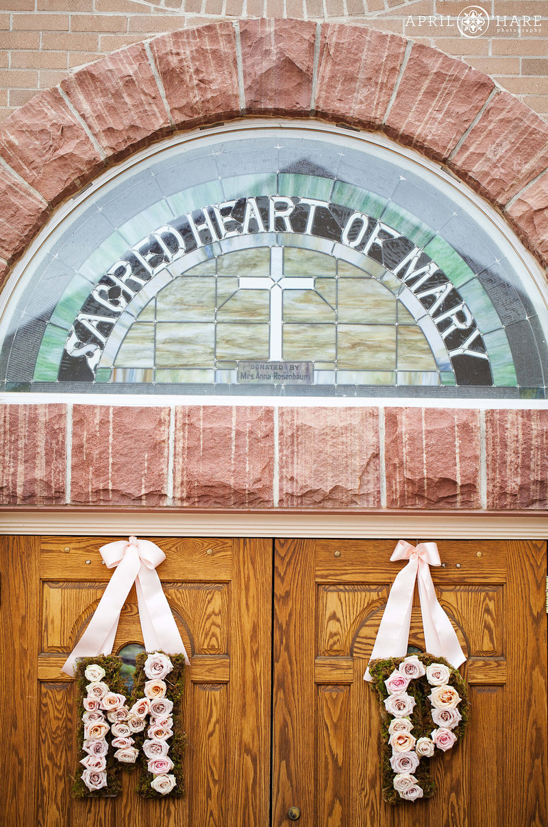 Front door decorated for wedding at Sacred Heart of Mary in Boulder CO