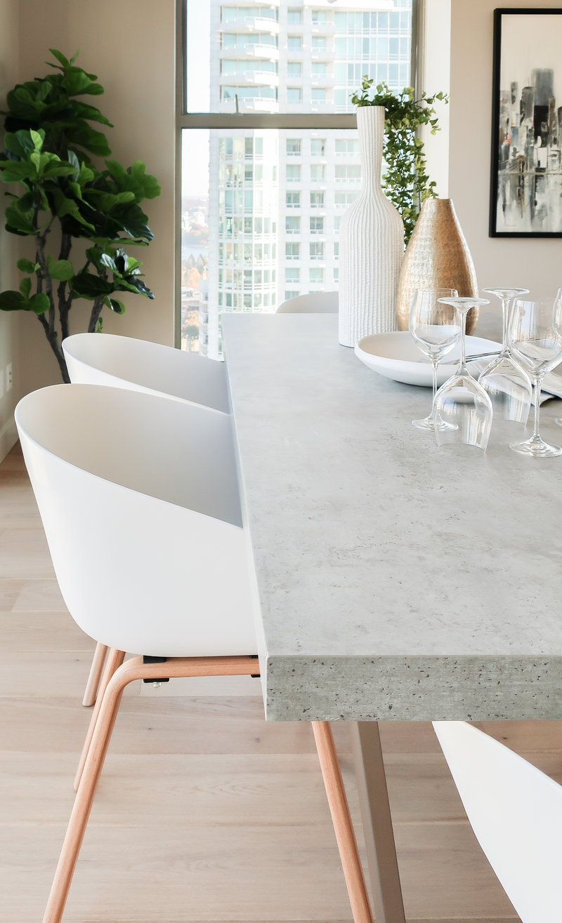 concrete table and white chairs