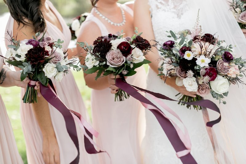 fall bridal bouquet and  bridesmaids bouquets featuring muted colors