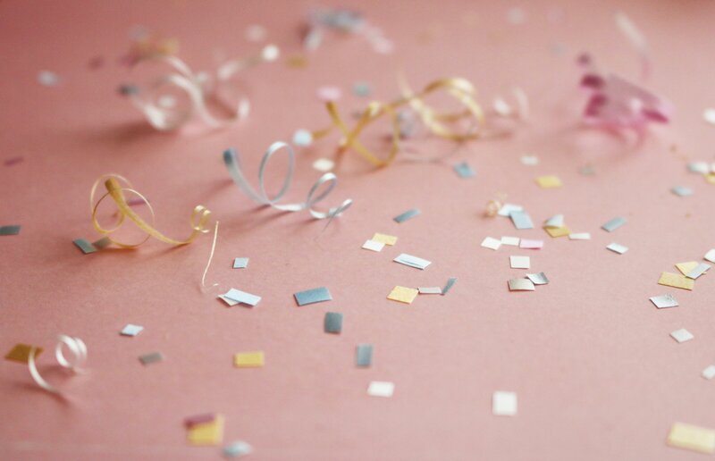 Pastel ribbons and confetti on soft pink background sets a mood for the brand designed by Knoxville branding company Liberty Type