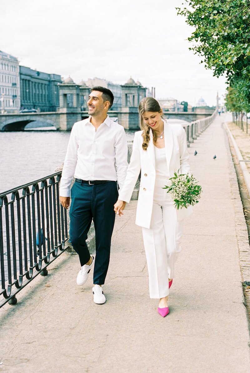 bride-and-groom-walking-by-water