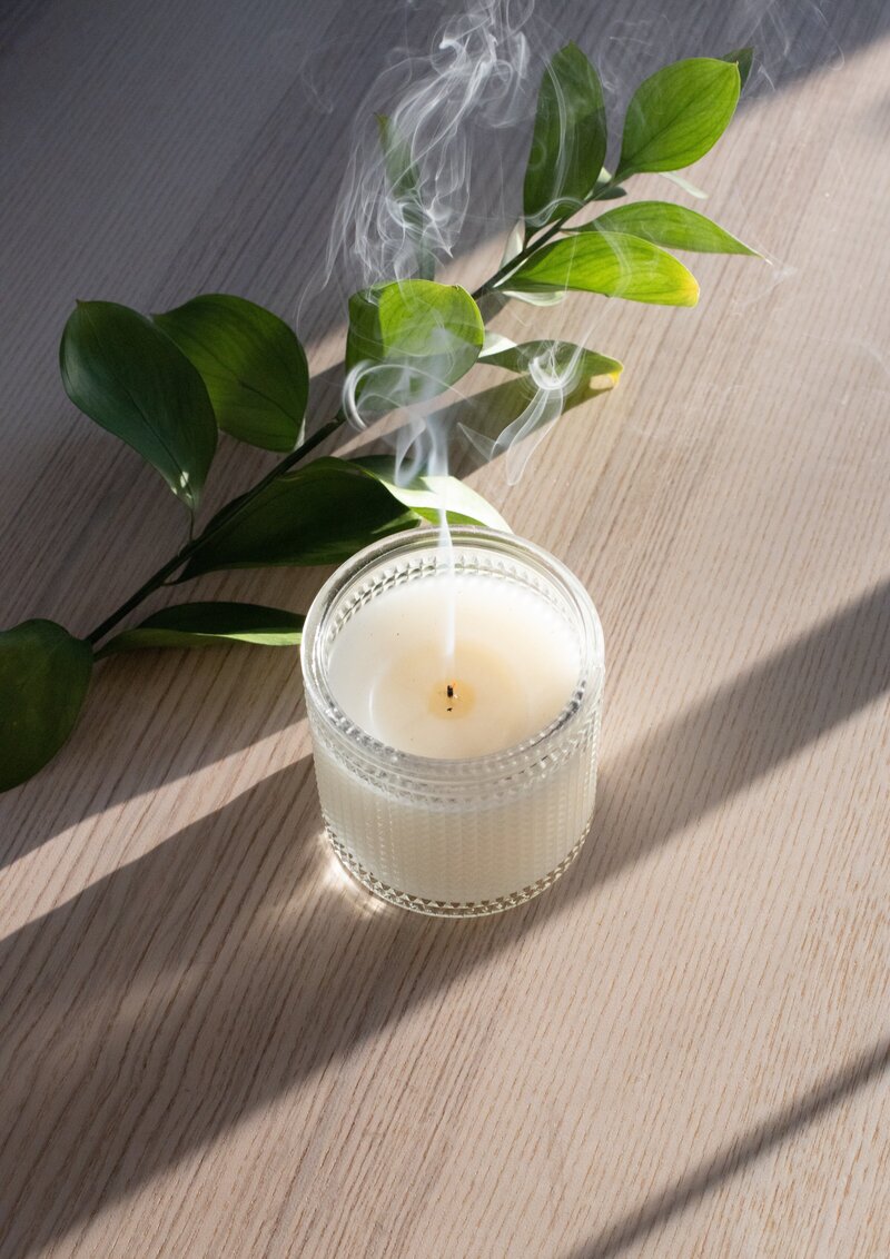 glass candle with greenery
