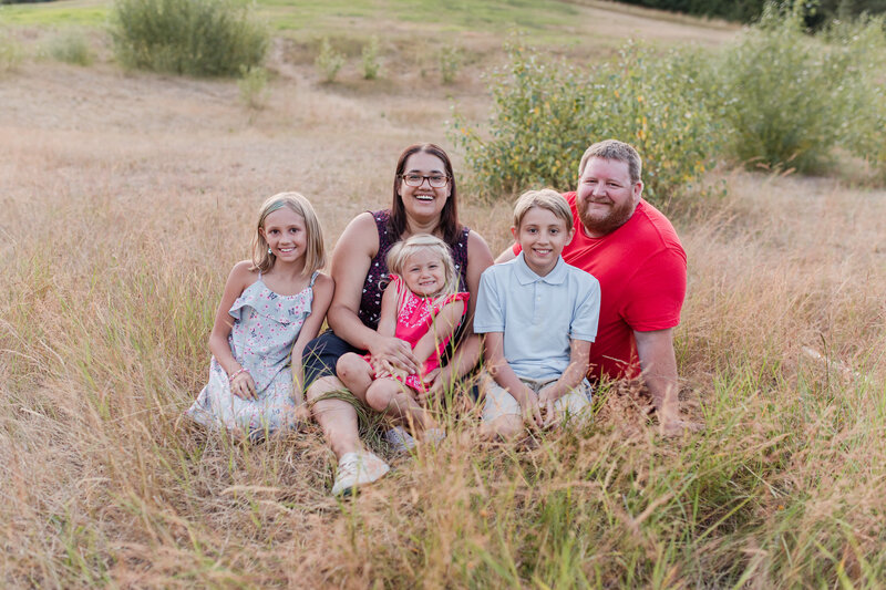 My three kids and husband posing for family portraits.