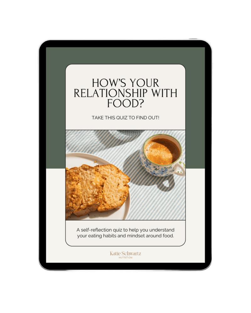 A digital tablet displaying a promotional quiz titled 'How’s Your Relationship with Food?' with the subtitle 'Take this quiz to find out!' Below the text, there is an image of a cup of espresso in a floral-patterned mug and slices of pistachio-topped pound cake on a white plate, placed on a blue-and-white striped tablecloth. The bottom text describes it as a self-reflection quiz to help understand eating habits and mindset around food. The branding at the bottom reads 'Katie Schwartz Nutrition.