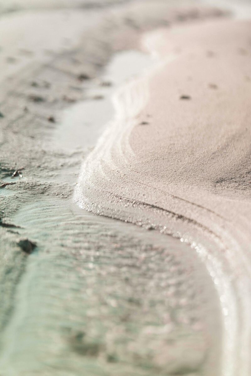 Gentle shoreline pattern representing calm, clarity, and answers to common trauma recovery questions