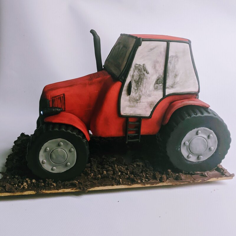 Gravity-defying tractor cake with working headlights
