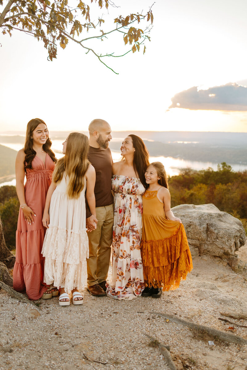 family dressed up and standing together