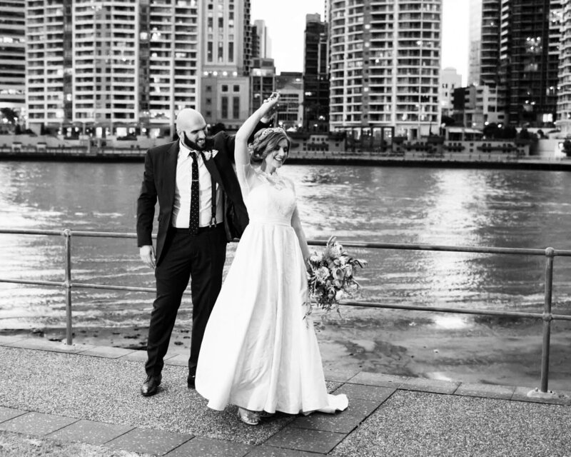 Bride turning in dance with groom at  Brisbane City
