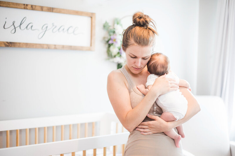 Mom and Baby in light and airy nursery shot by Ann Arbor Newborn Photographer