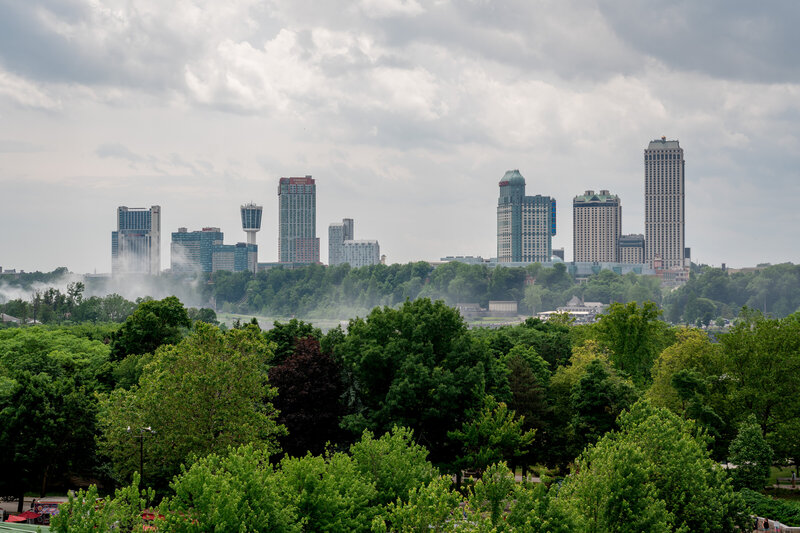 A city skyline in the background, Niagara Falls NY, photographed by wedding photographer Niko Coric - Lumen Clarity Media